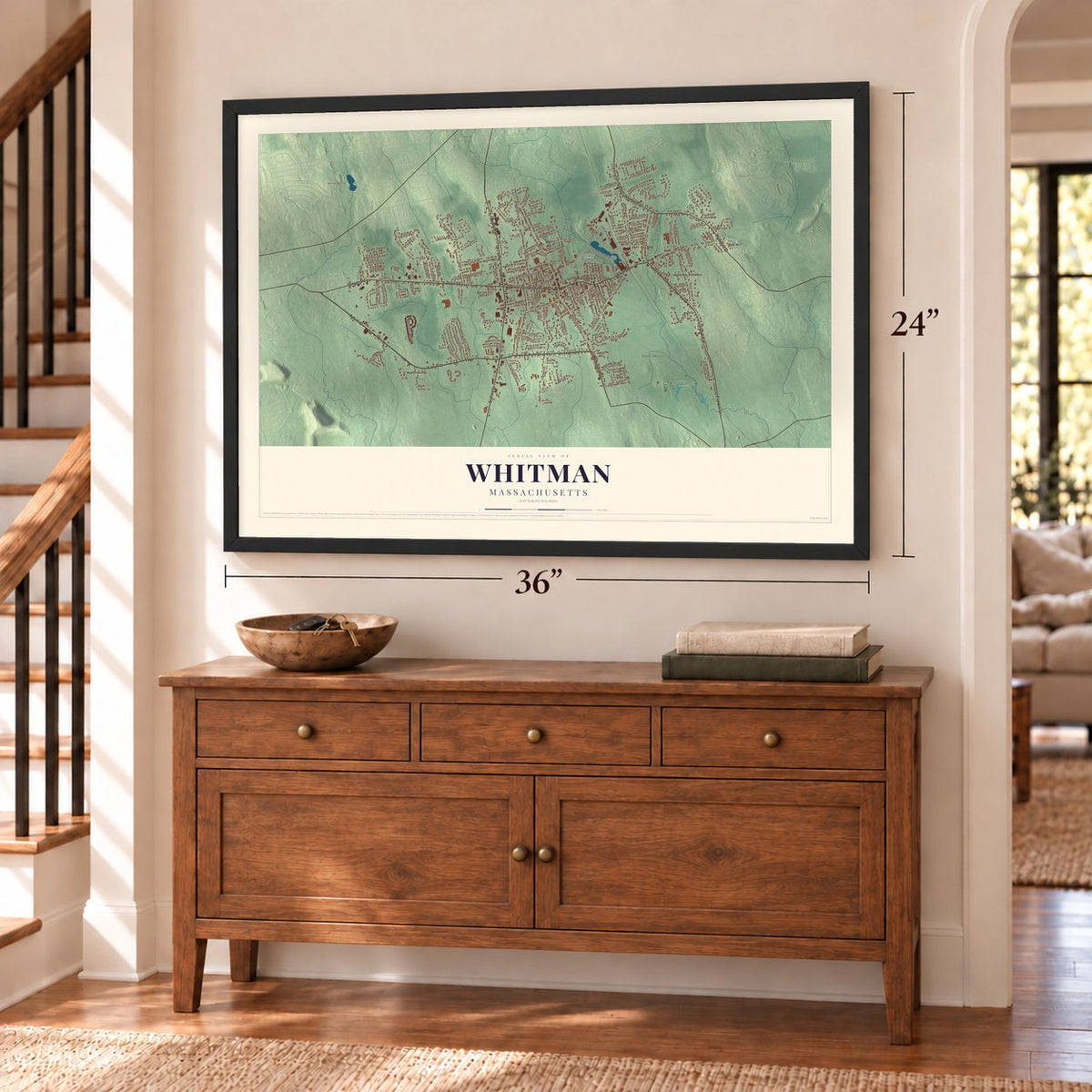 Whitman, Massachusetts map, 24 x 36 inch print in a black frame above a dresser by a staircase