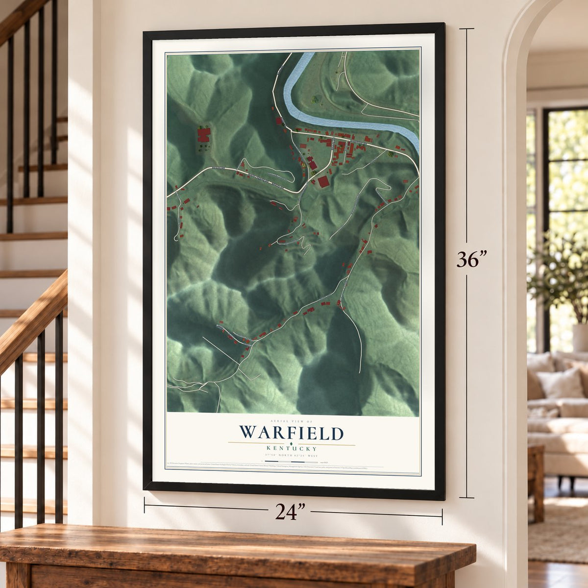 Warfield, Kentucky map, 24 x 36 inch print in a black frame by a staircase