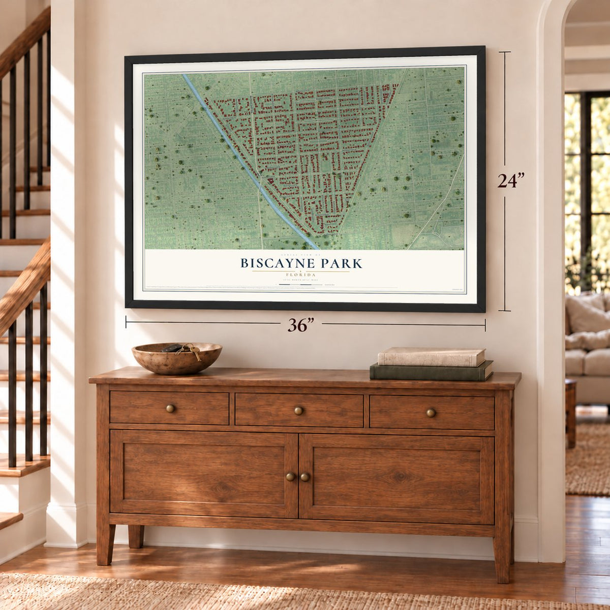 Biscayne Park, Florida map, 24 x 36 inch print in a black frame above a dresser by a staircase