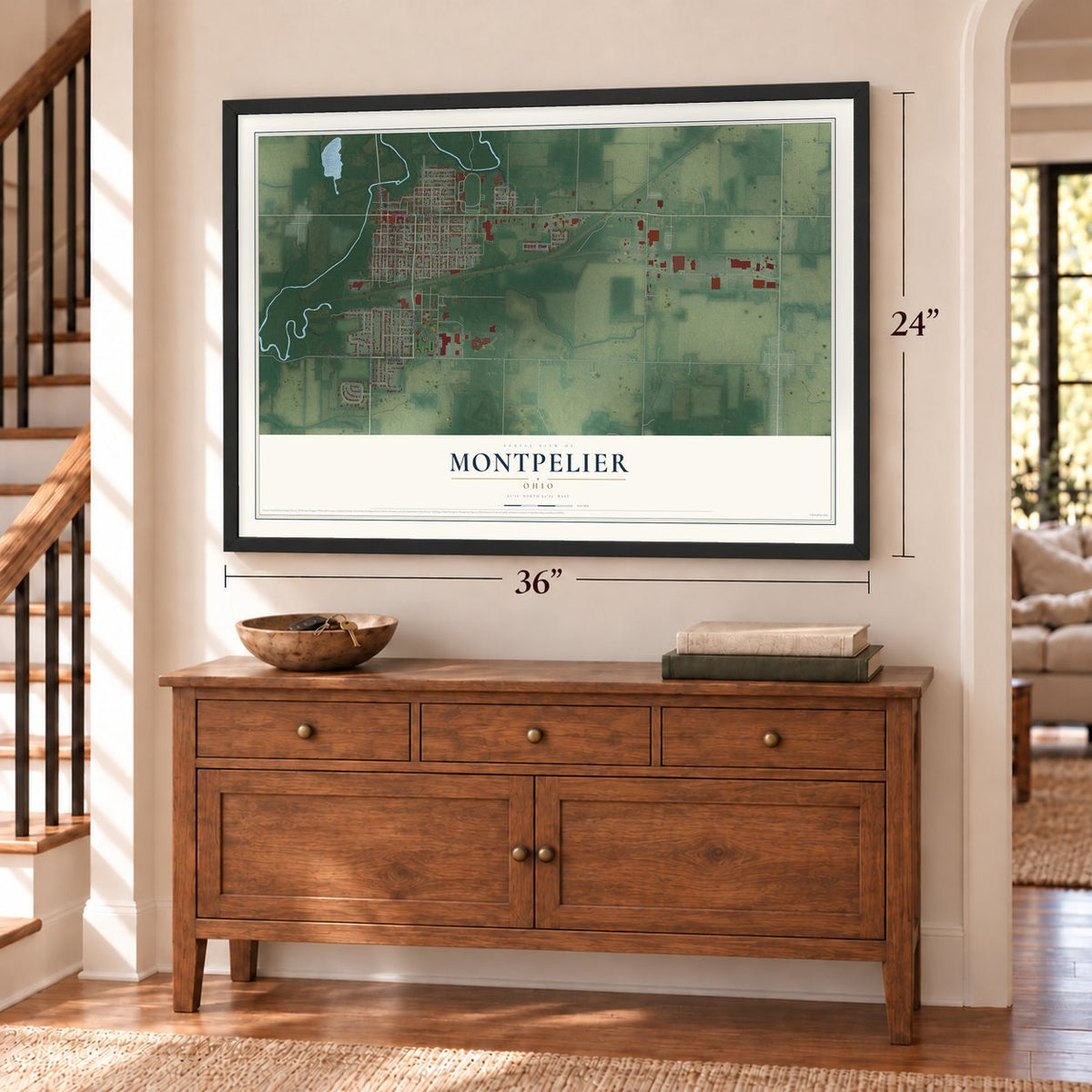 Montpelier, Ohio map, 24 x 36 inch print in a black frame above a dresser by a staircase