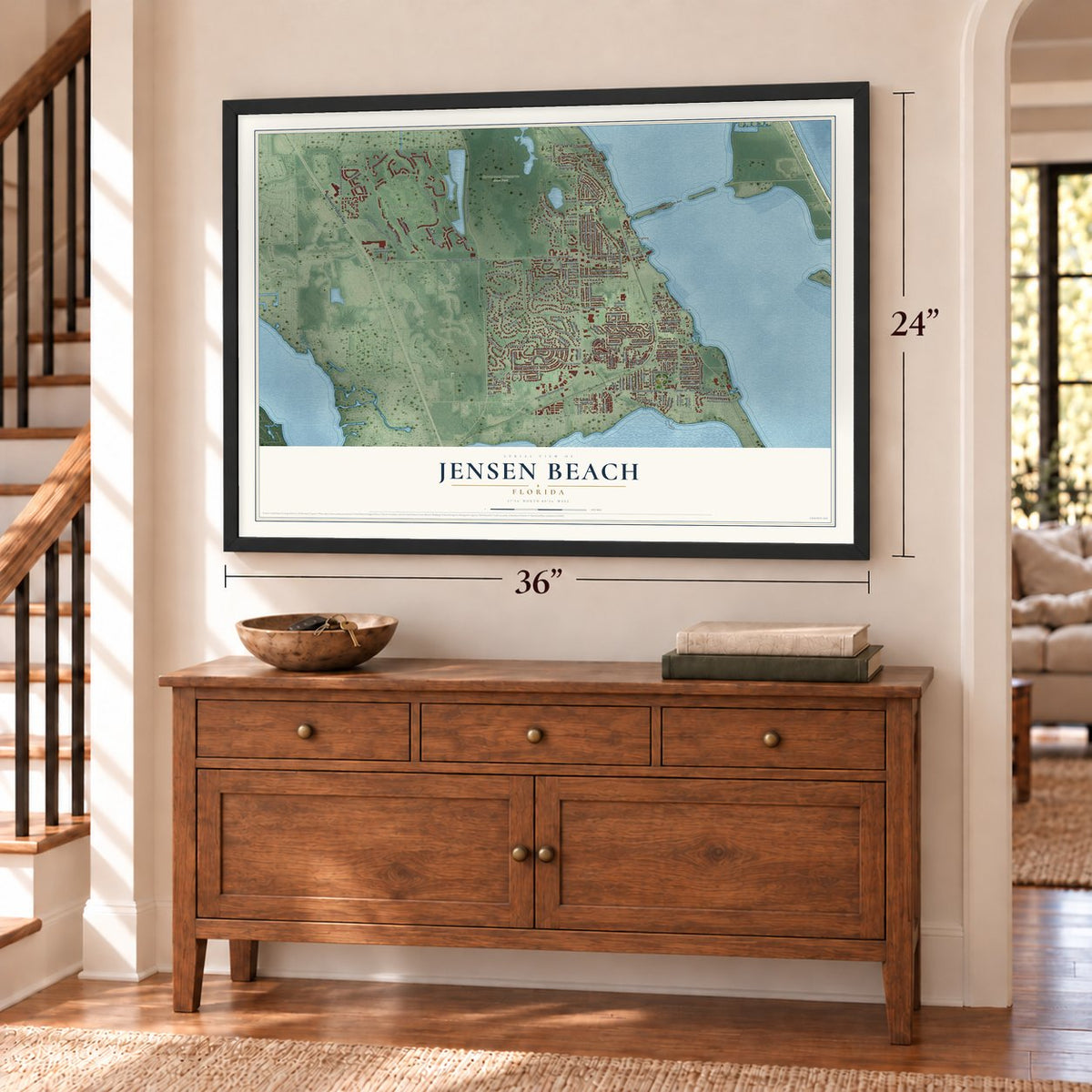 Jensen Beach, Florida map, 24 x 36 inch print in a black frame above a dresser by a staircase
