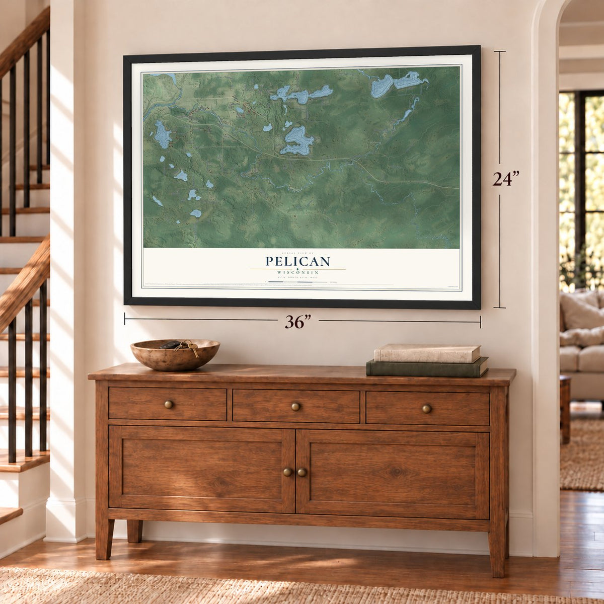 Pelican, Wisconsin map, 24 x 36 inch print in a black frame above a dresser by a staircase
