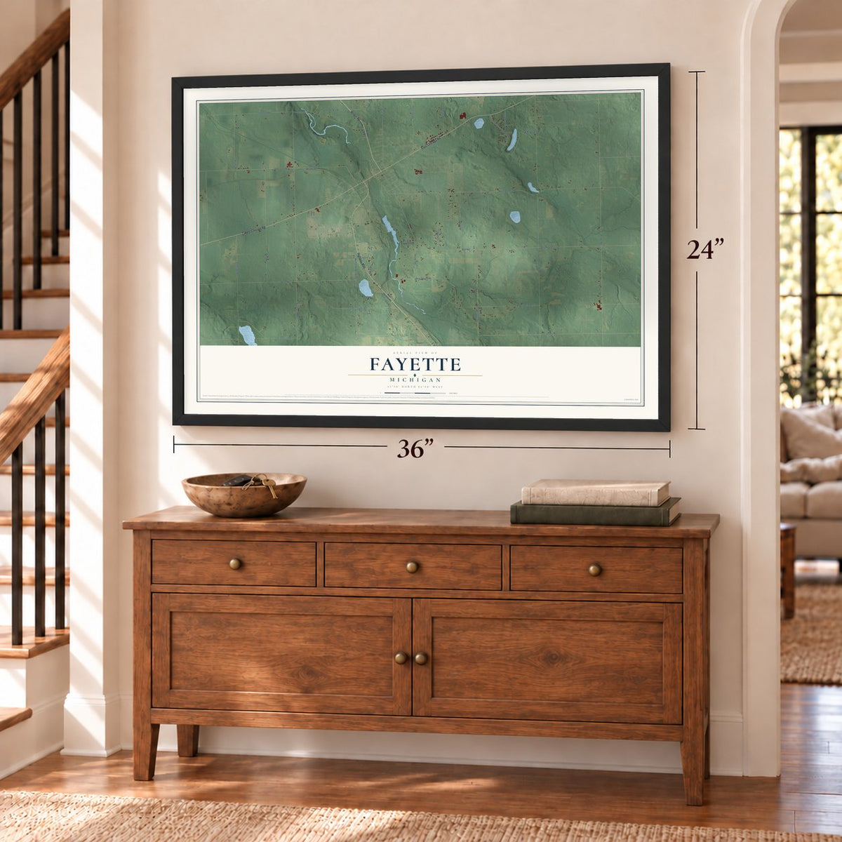 Fayette, Michigan map, 24 x 36 inch print in a black frame above a dresser by a staircase