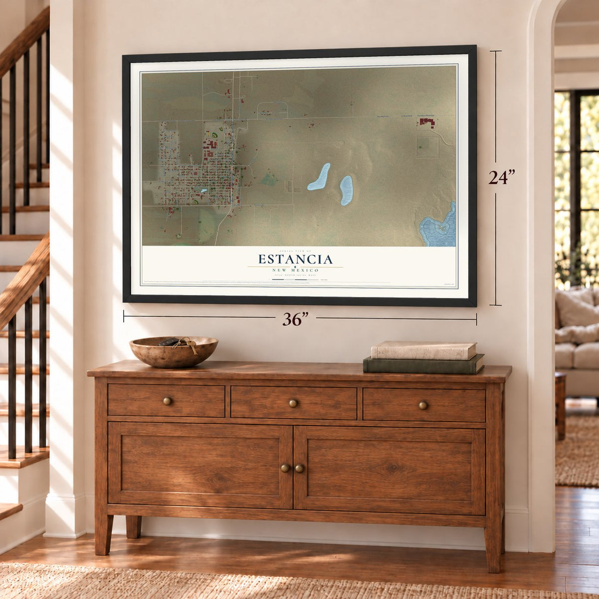 Estancia, New Mexico map, 24 x 36 inch print in a black frame above a dresser by a staircase