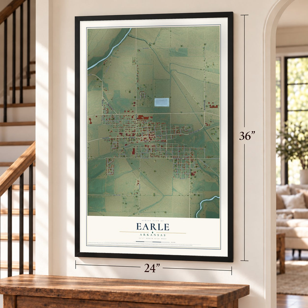 Earle, Arkansas map, 24 x 36 inch print in a black frame by a staircase