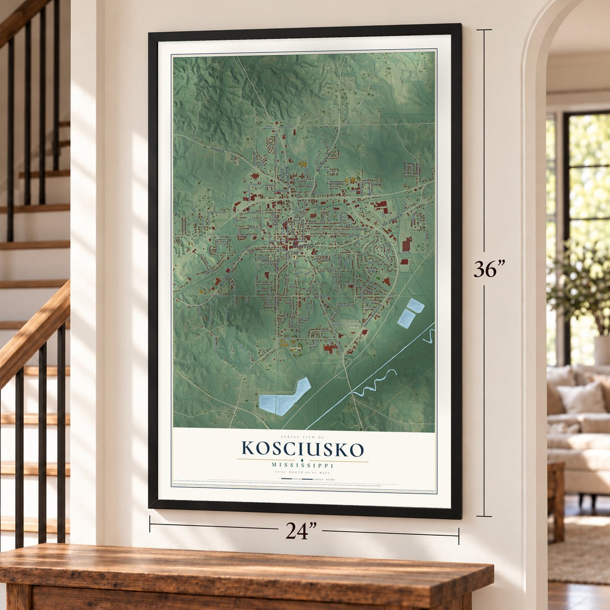 Kosciusko, Mississippi map, 24 x 36 inch print in a black frame by a staircase