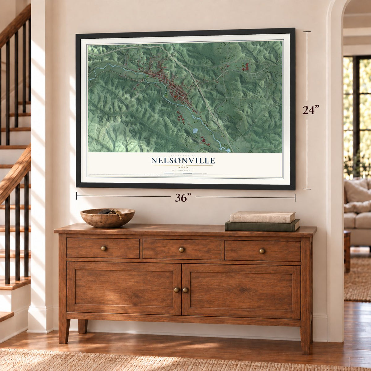 Nelsonville, Ohio map, 24 x 36 inch print in a black frame above a dresser by a staircase