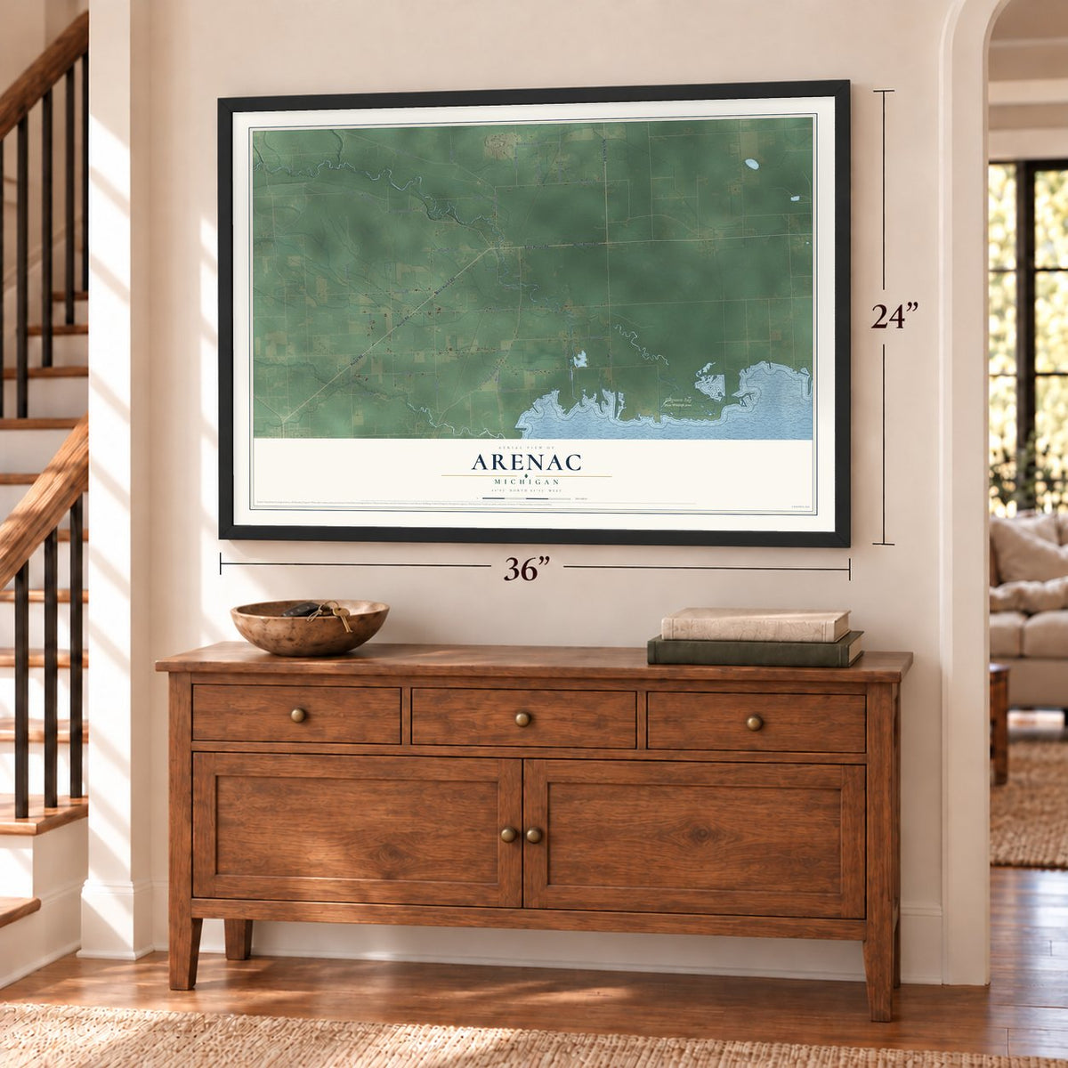 Arenac, Michigan map, 24 x 36 inch print in a black frame above a dresser by a staircase