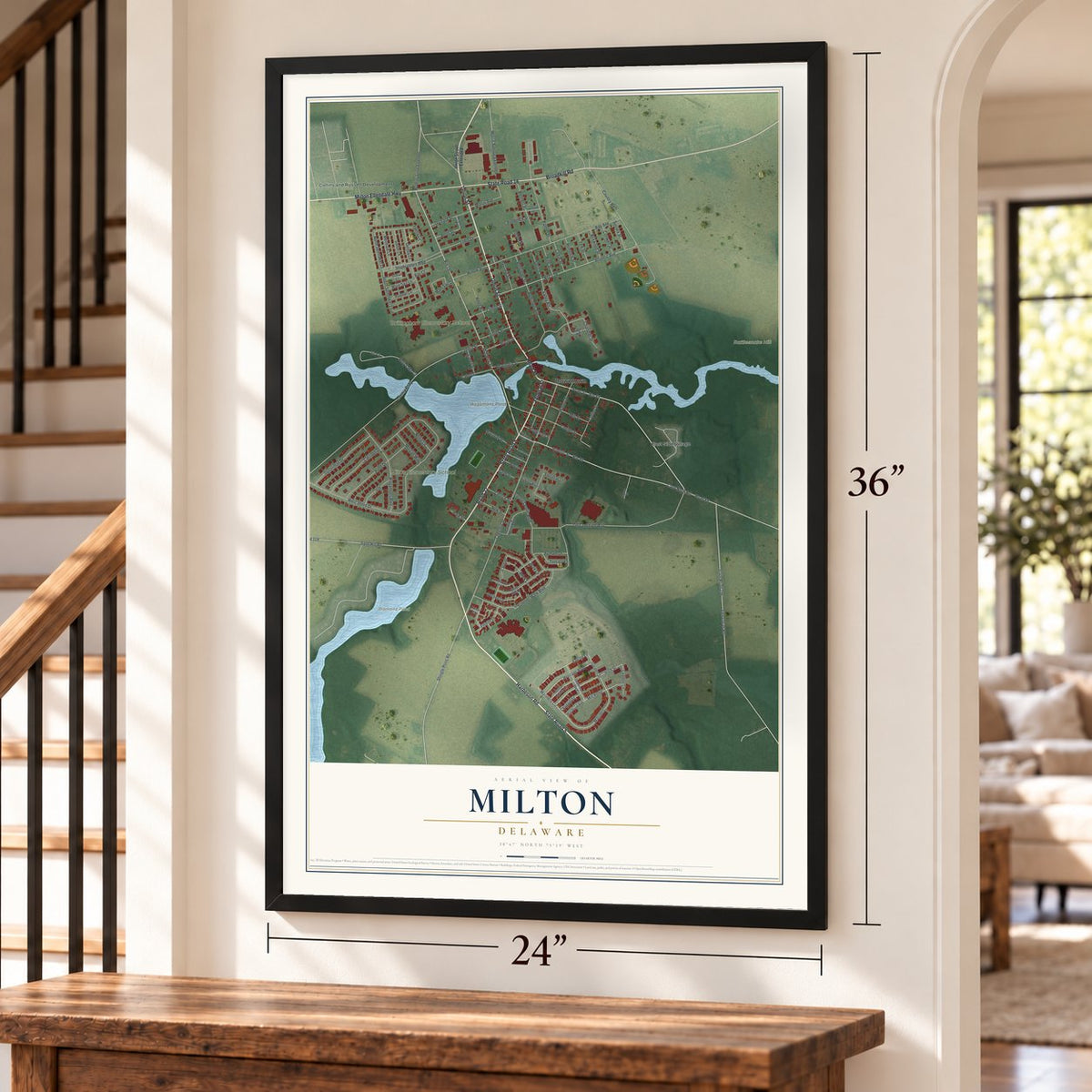 Milton, Delaware map, 24 x 36 inch print in a black frame by a staircase