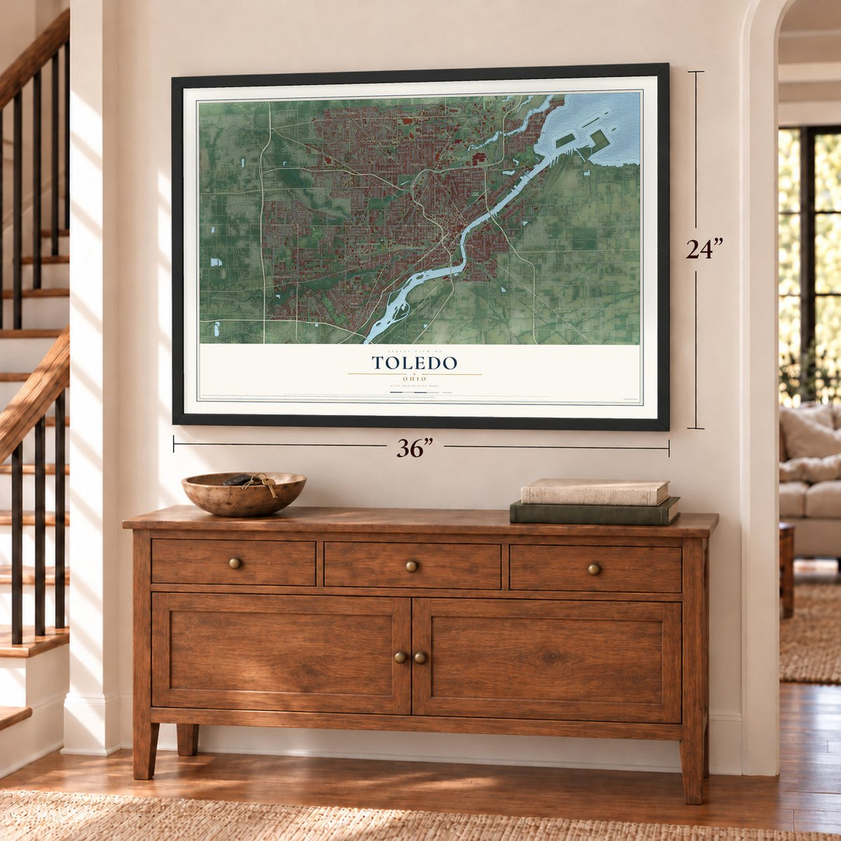 Toledo, Ohio map, 24 x 36 inch print in a black frame above a dresser by a staircase