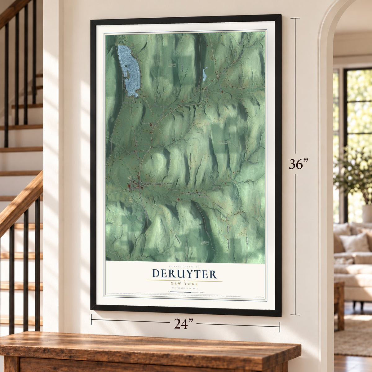 DeRuyter, New York map, 24 x 36 inch print in a black frame by a staircase