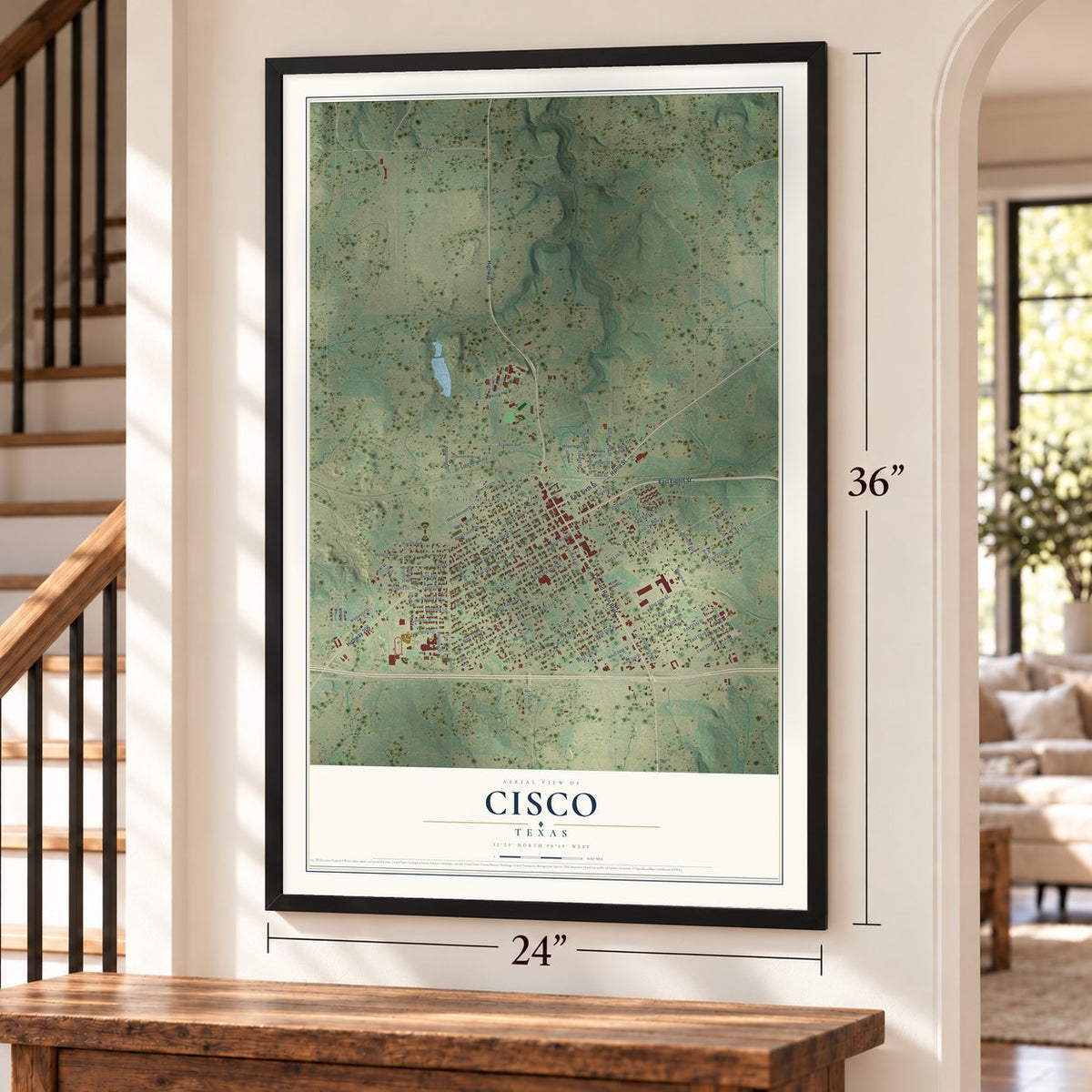 Cisco, Texas map, 24 x 36 inch print in a black frame by a staircase