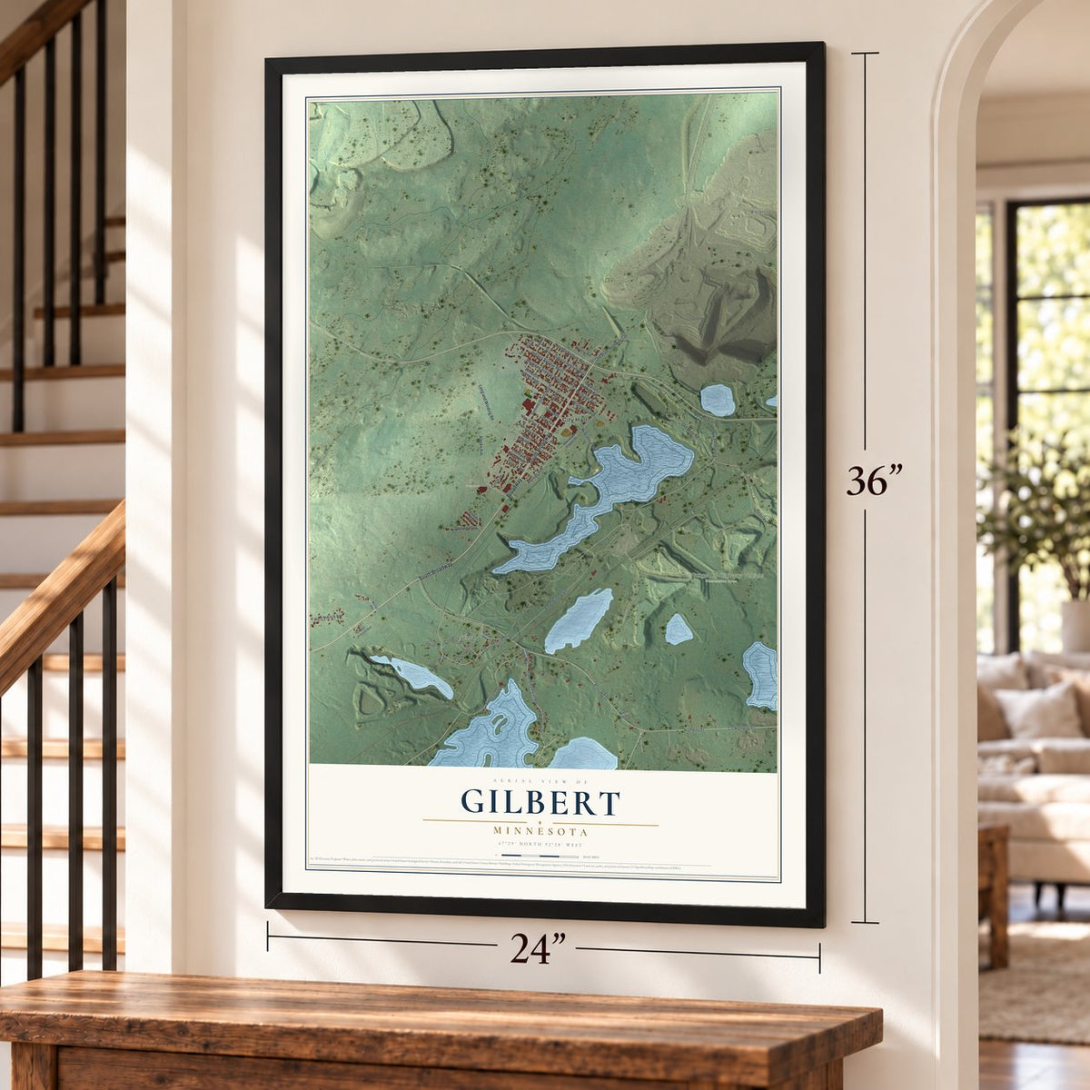 Gilbert, Minnesota map, 24 x 36 inch print in a black frame by a staircase