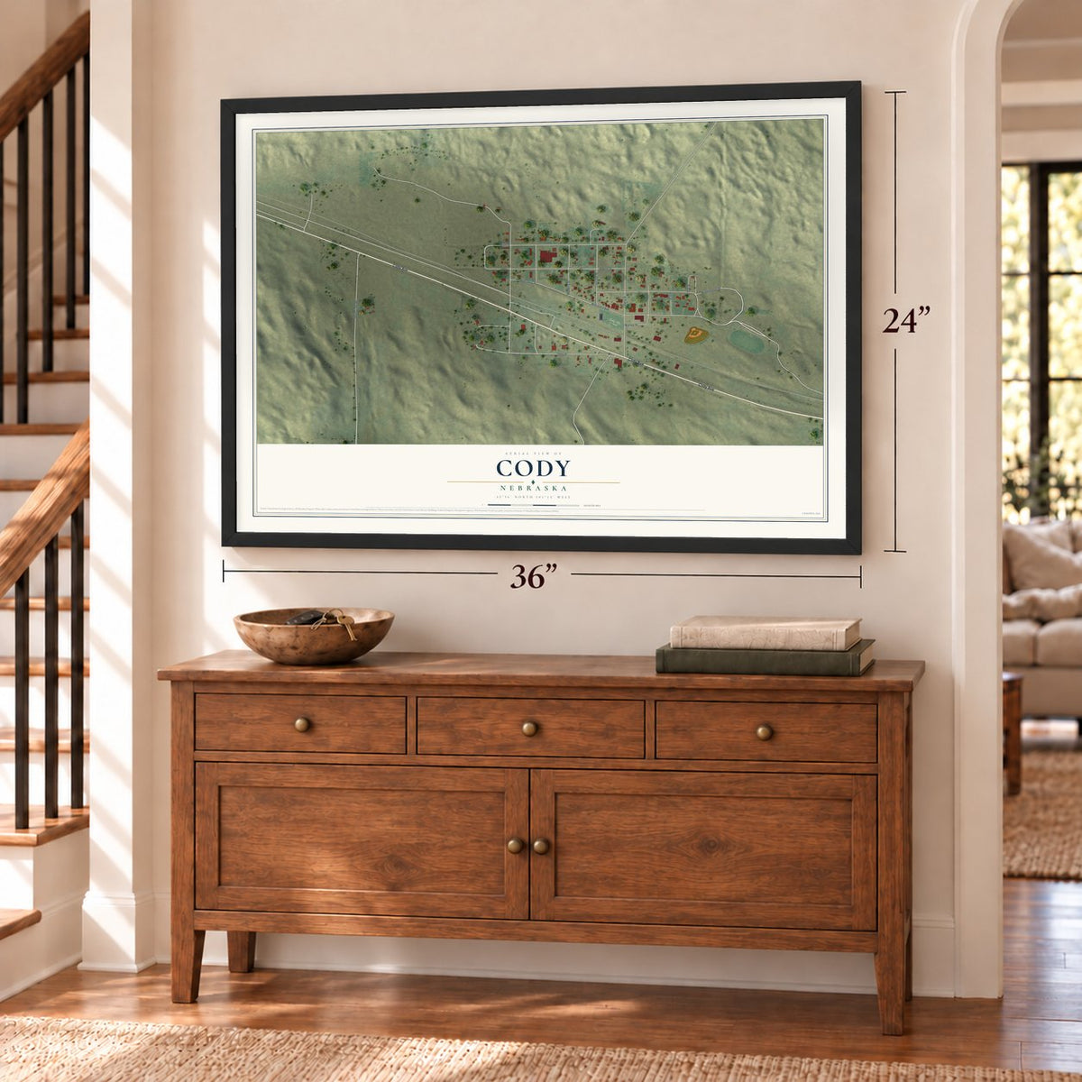 Cody, Nebraska map, 24 x 36 inch print in a black frame above a dresser by a staircase