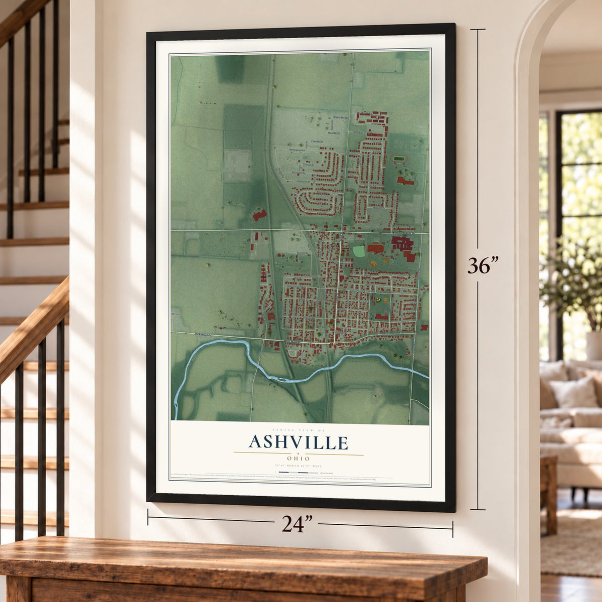 Ashville, Ohio map, 24 x 36 inch print in a black frame by a staircase
