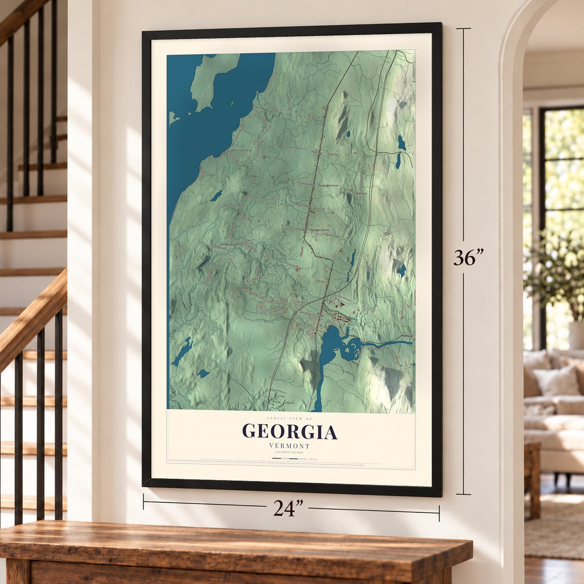 Georgia, Vermont map, 24 x 36 inch print in a black frame by a staircase