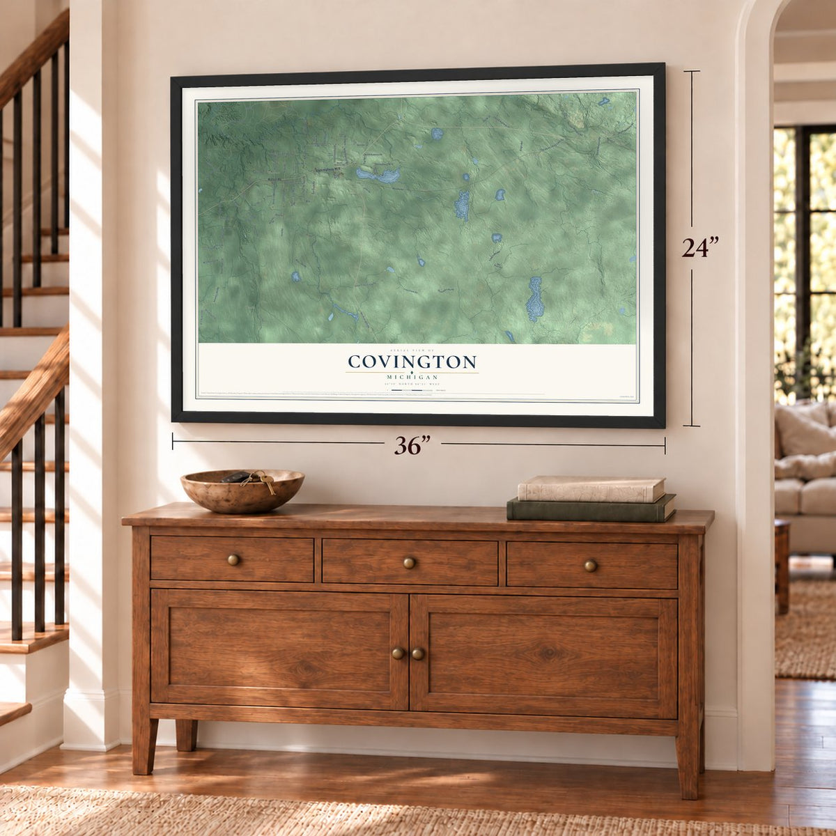 Covington, Michigan map, 24 x 36 inch print in a black frame above a dresser by a staircase