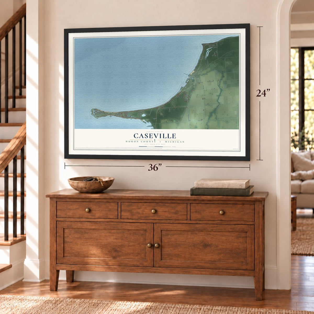 Caseville, Huron County, Michigan map, 24 x 36 inch print in a black frame above a dresser by a staircase