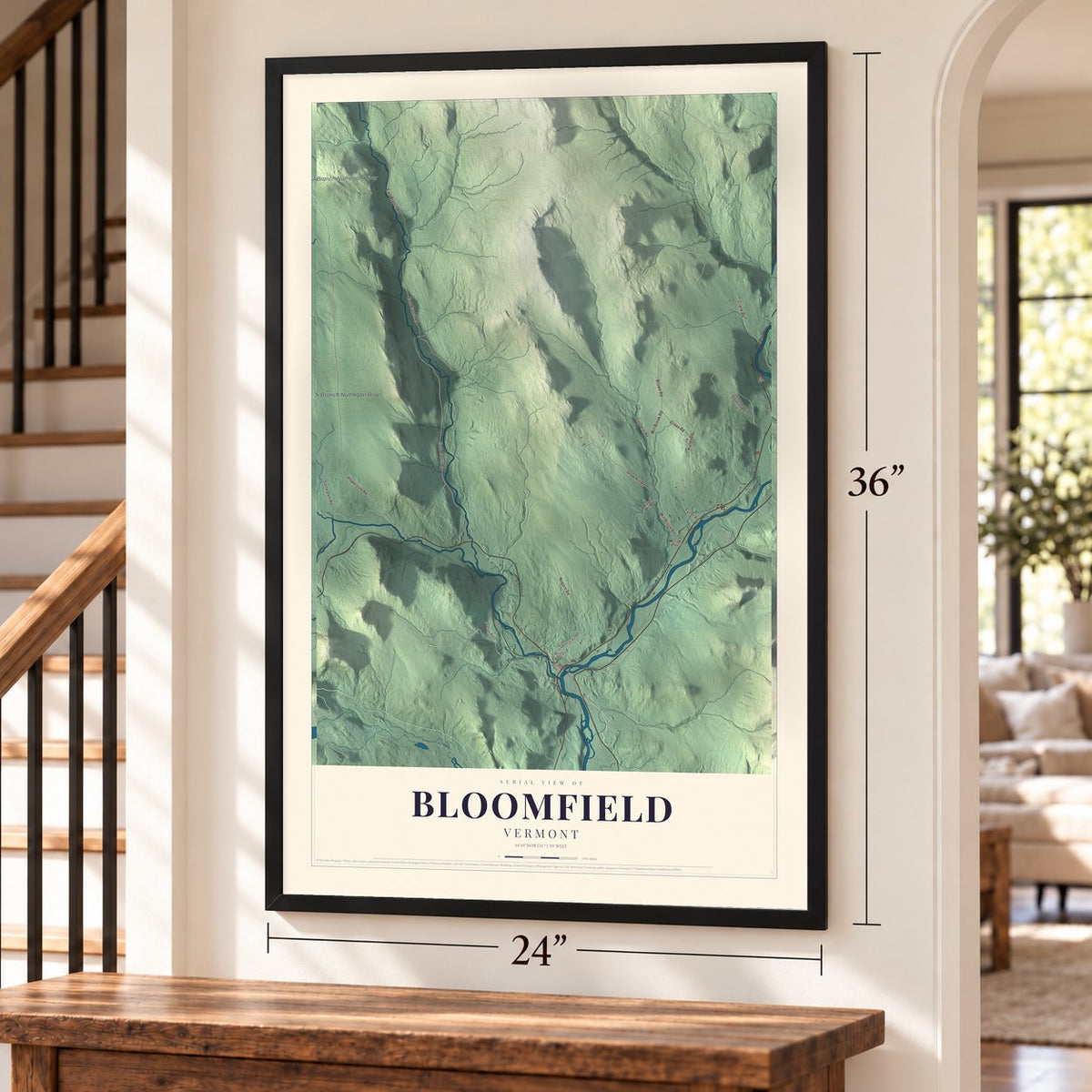 Bloomfield, Vermont map, 24 x 36 inch print in a black frame by a staircase