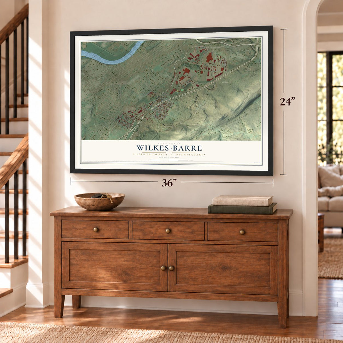 Wilkes-Barre, Luzerne County, Pennsylvania map, 24 x 36 inch print in a black frame above a dresser by a staircase