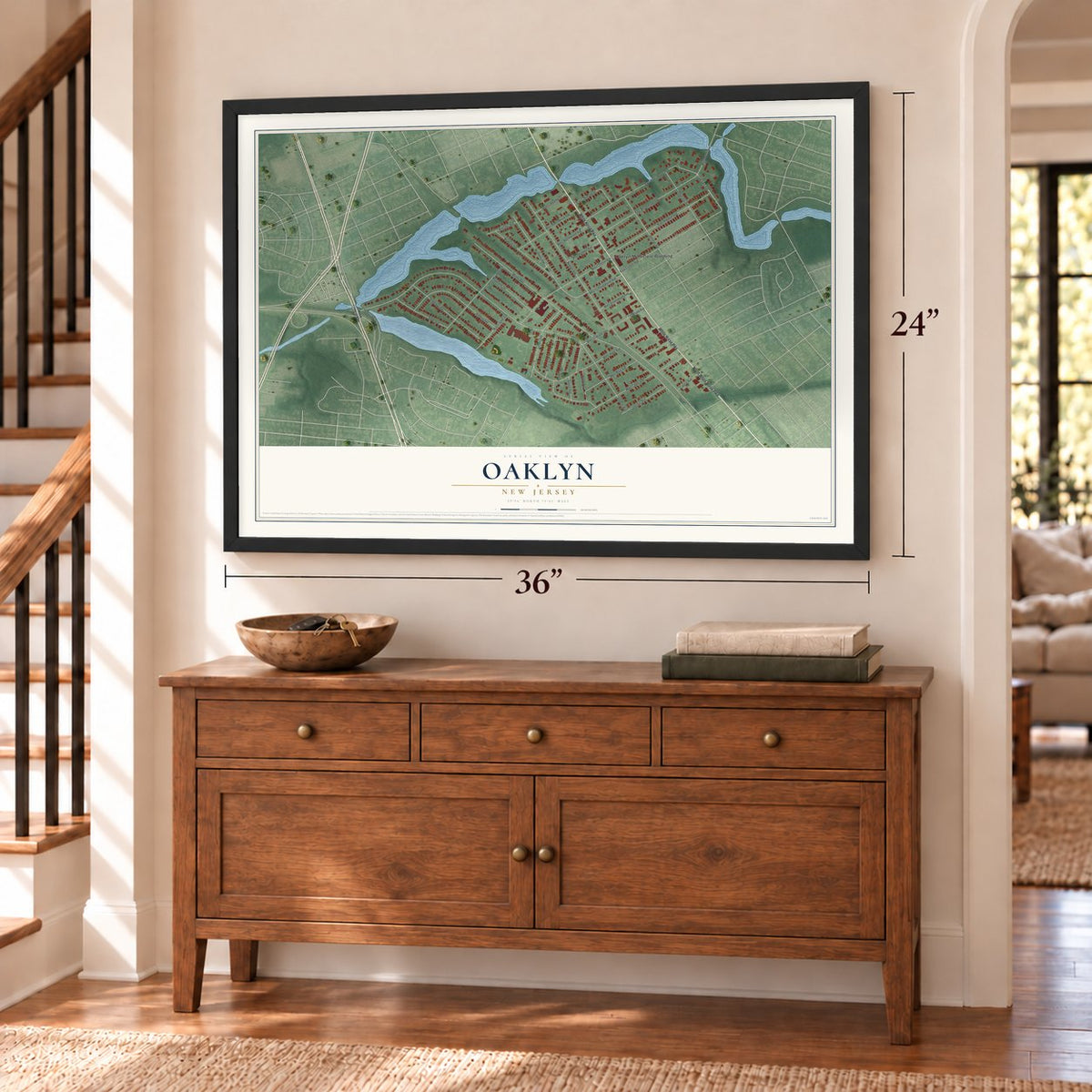 Oaklyn, New Jersey map, 24 x 36 inch print in a black frame above a dresser by a staircase