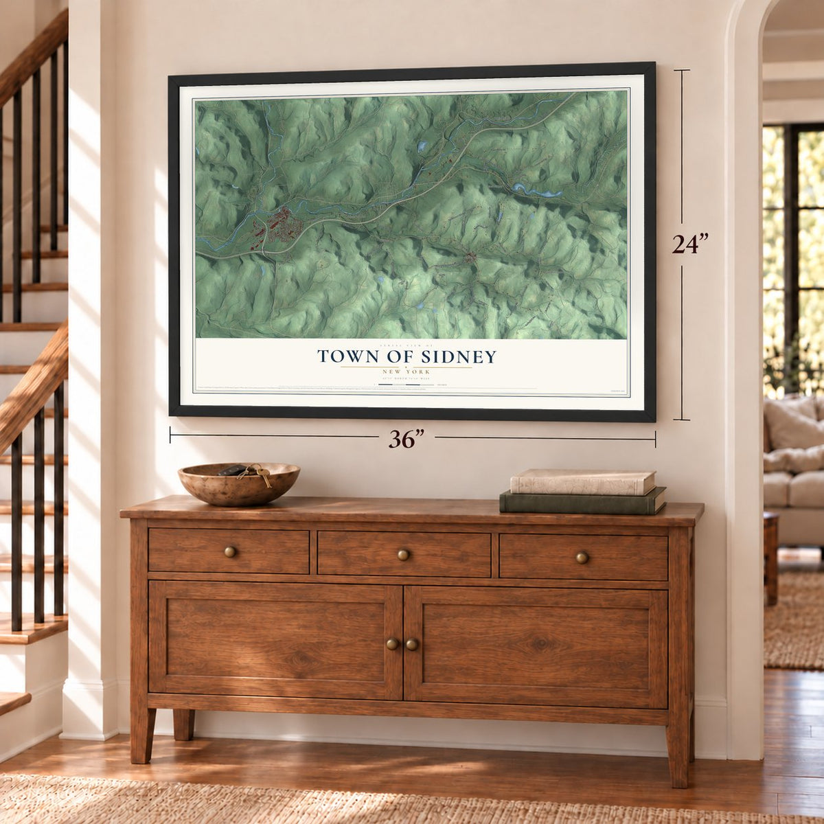 Town of Sidney, New York map, 24 x 36 inch print in a black frame above a dresser by a staircase