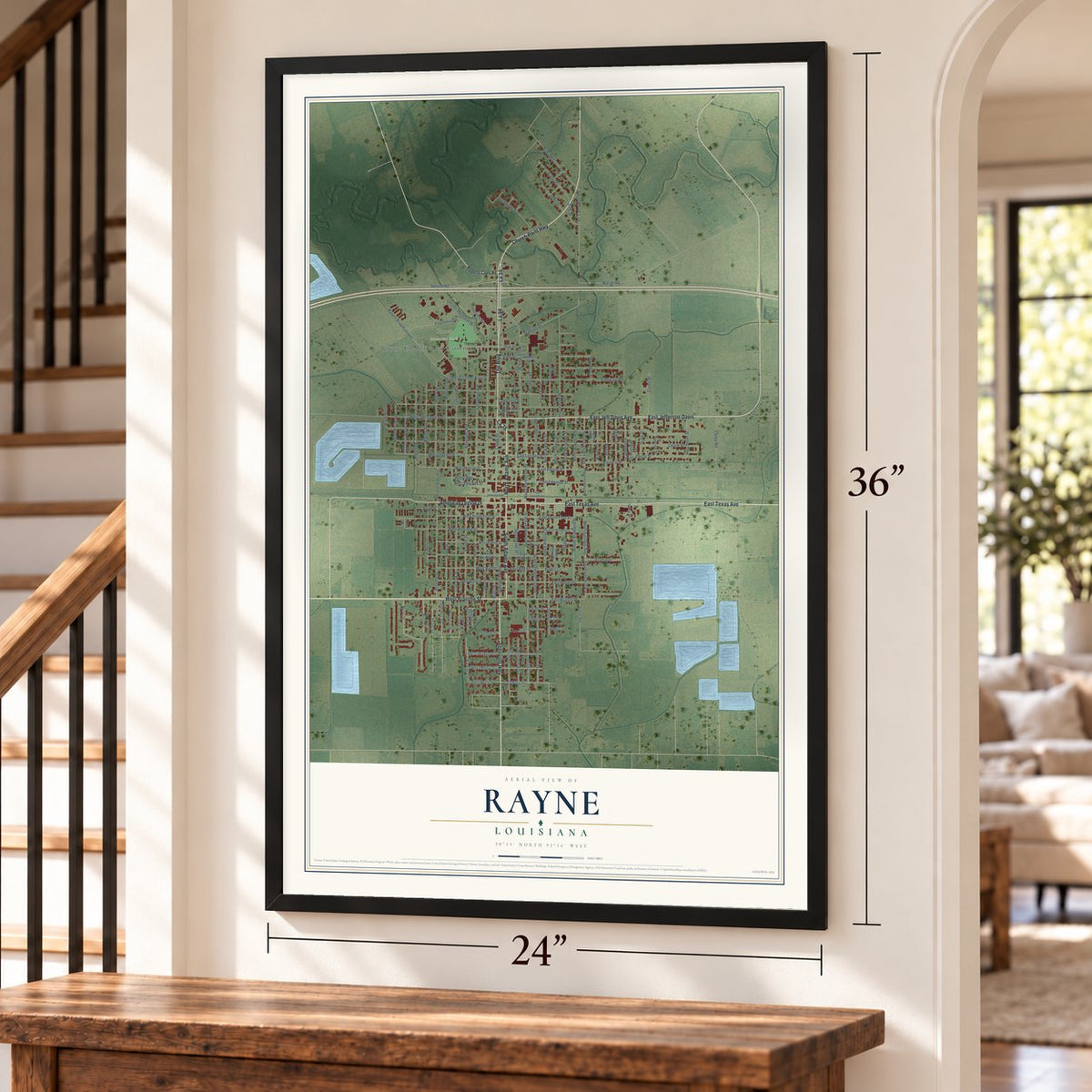 Rayne, Louisiana map, 24 x 36 inch print in a black frame by a staircase