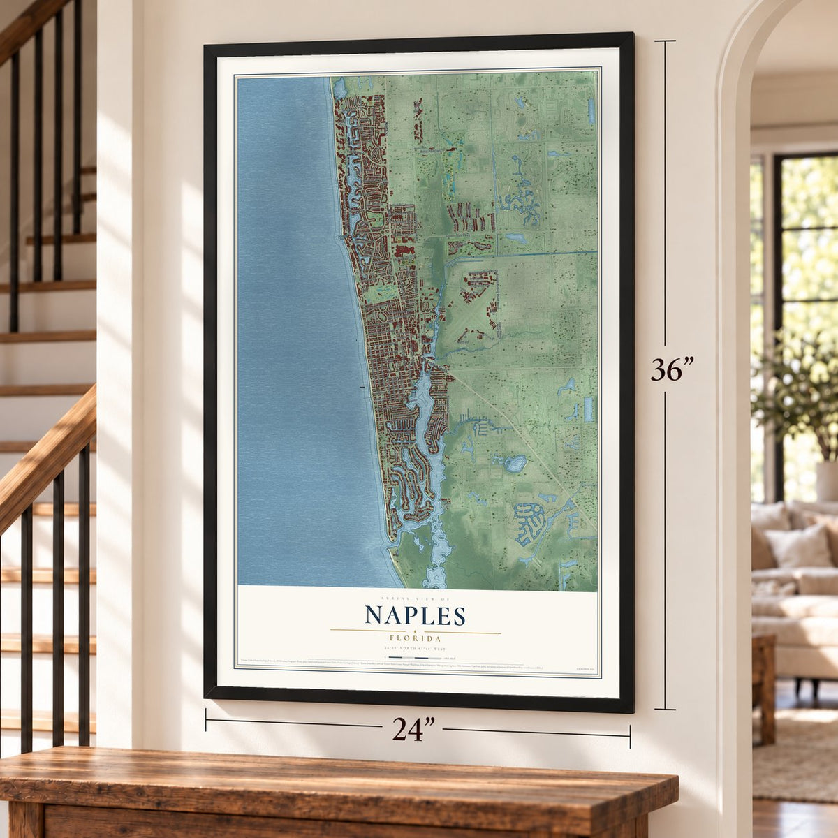 Naples, Florida map, 24 x 36 inch print in a black frame by a staircase