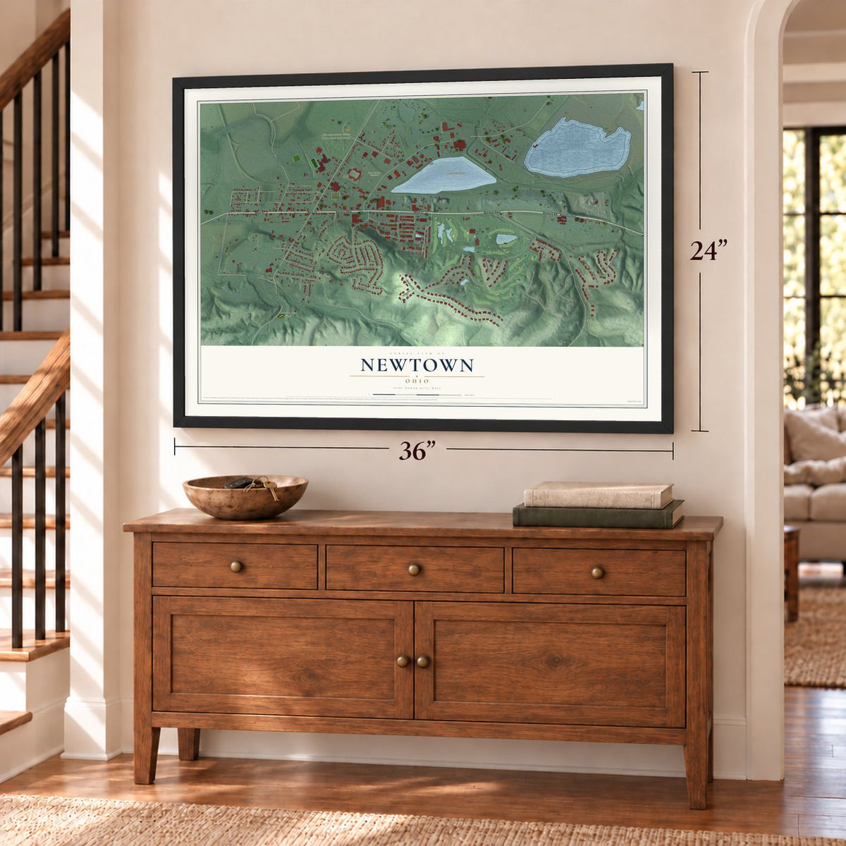 Newtown, Ohio map, 24 x 36 inch print in a black frame above a dresser by a staircase