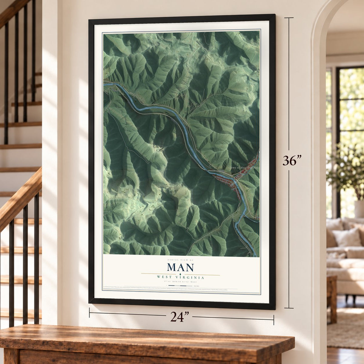 Man, West Virginia map, 24 x 36 inch print in a black frame by a staircase
