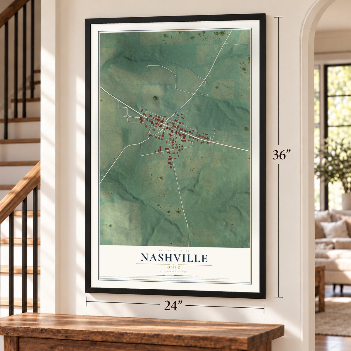 Nashville, Ohio map, 24 x 36 inch print in a black frame by a staircase