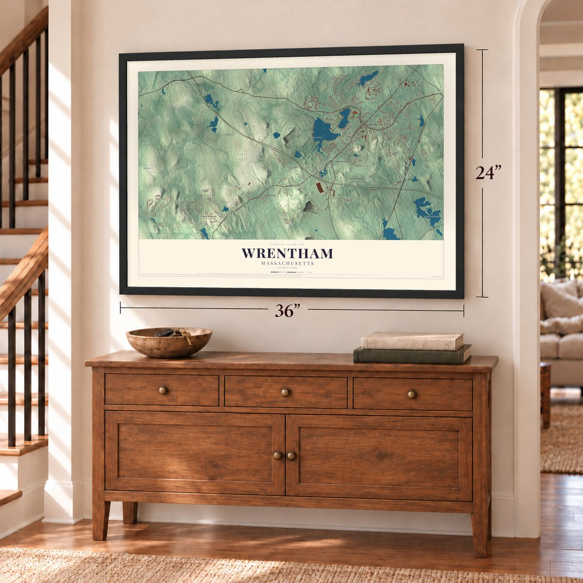 Wrentham, Massachusetts map, 24 x 36 inch print in a black frame above a dresser by a staircase