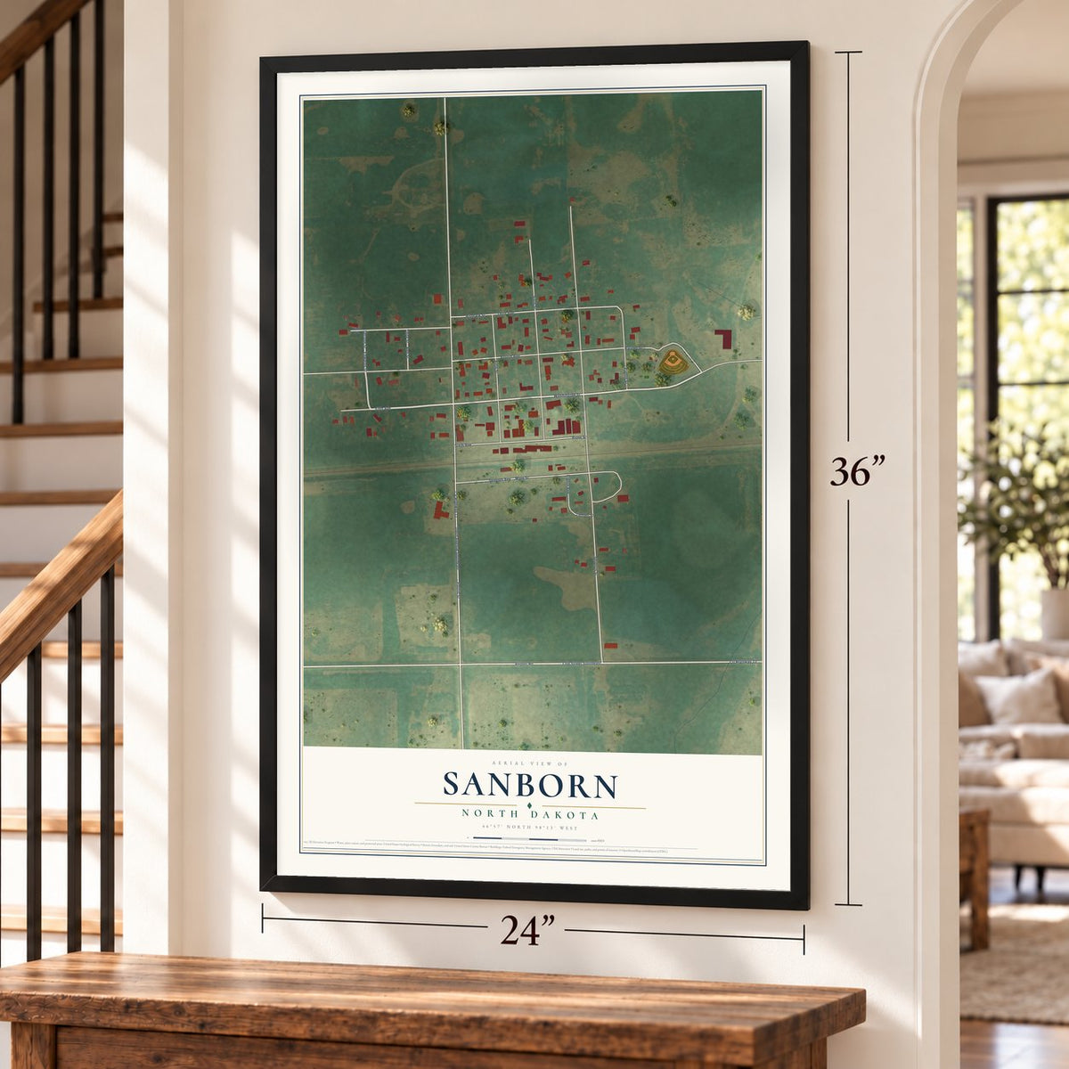 Sanborn, North Dakota map, 24 x 36 inch print in a black frame by a staircase