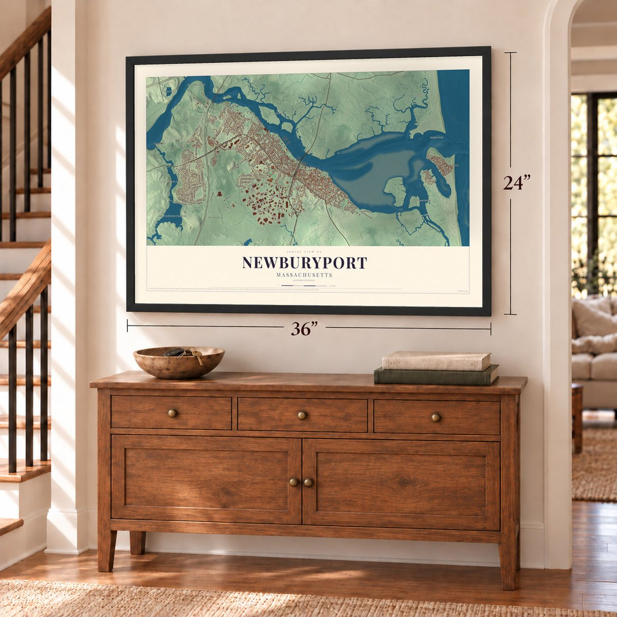 Newburyport, Massachusetts map, 24 x 36 inch print in a black frame above a dresser by a staircase