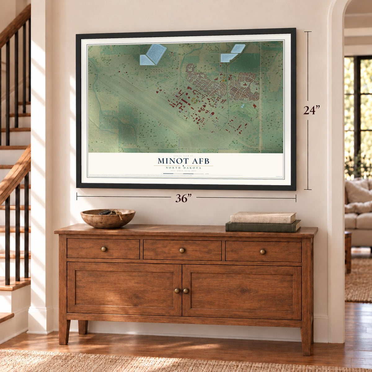 Minot AFB, North Dakota map, 24 x 36 inch print in a black frame above a dresser by a staircase