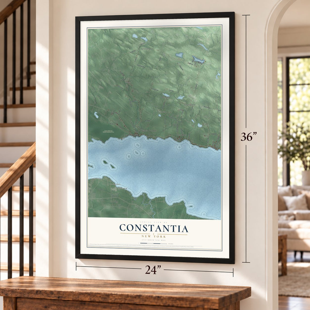 Constantia, New York map, 24 x 36 inch print in a black frame by a staircase