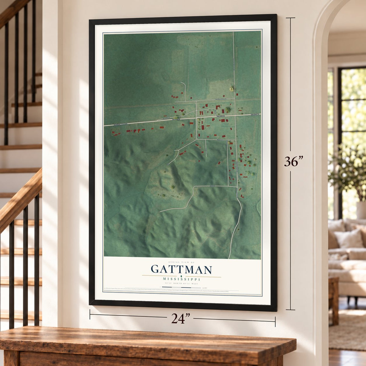 Gattman, Mississippi map, 24 x 36 inch print in a black frame by a staircase