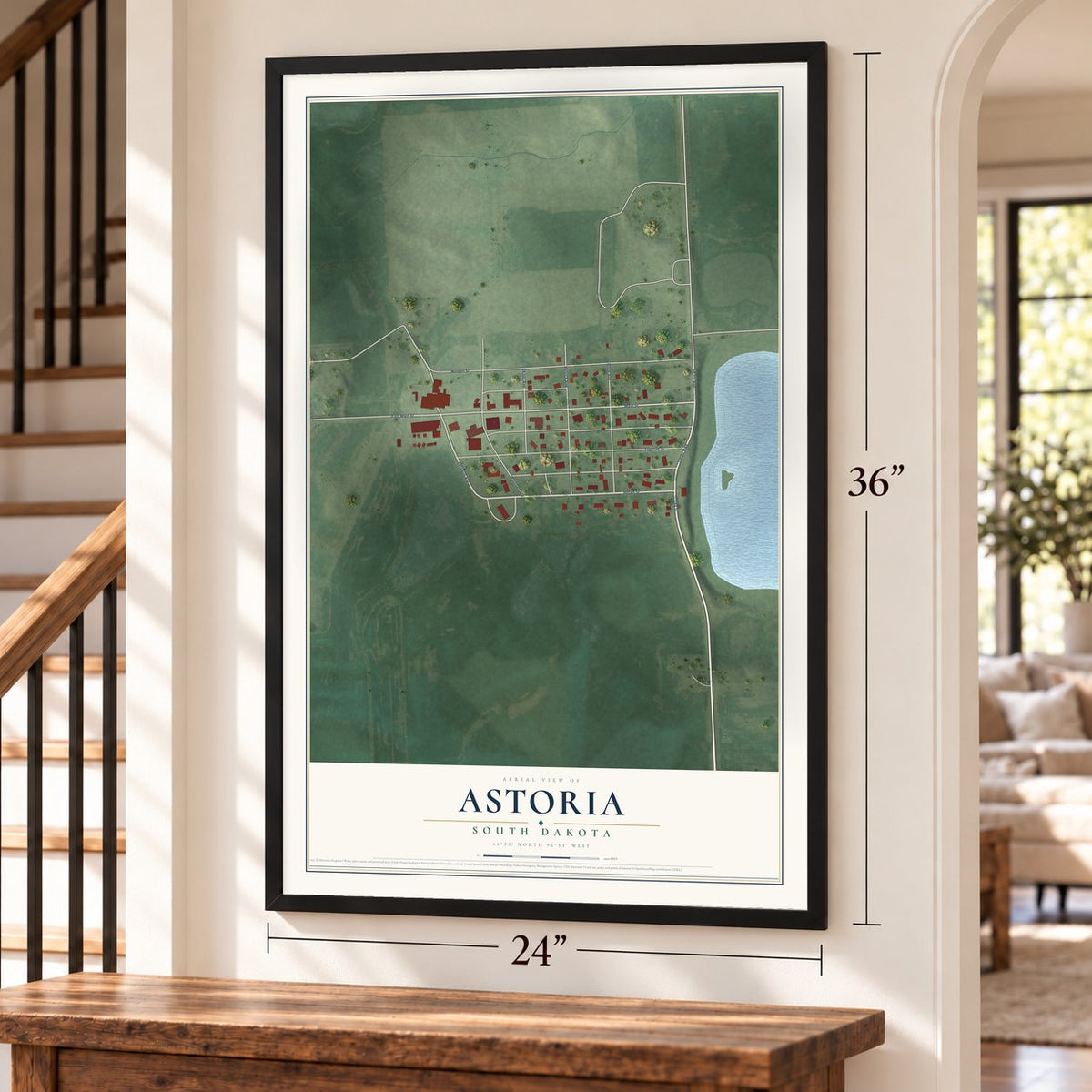 Astoria, South Dakota map, 24 x 36 inch print in a black frame by a staircase
