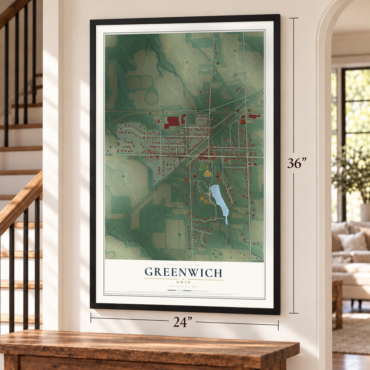 Greenwich, Ohio map, 24 x 36 inch print in a black frame by a staircase