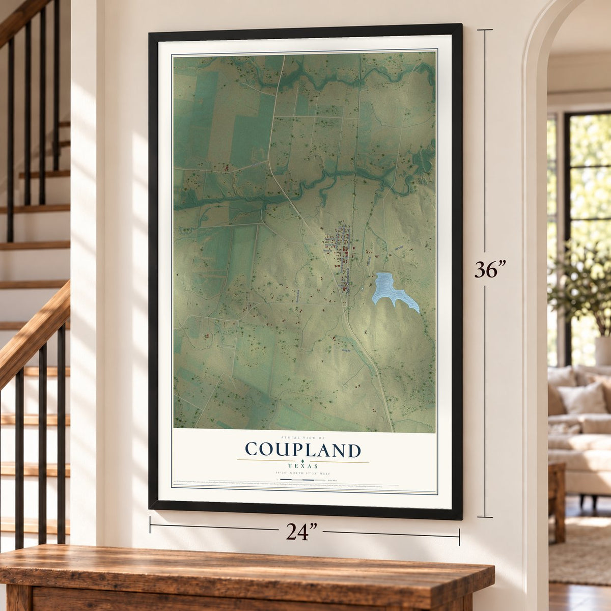 Coupland, Texas map, 24 x 36 inch print in a black frame by a staircase