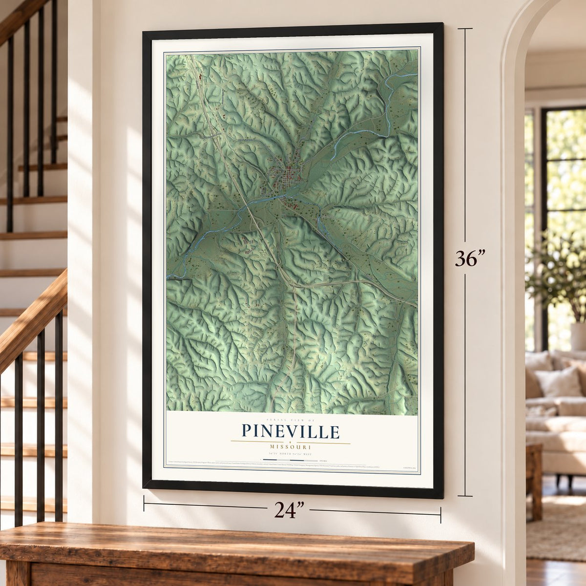 Pineville, Missouri map, 24 x 36 inch print in a black frame by a staircase