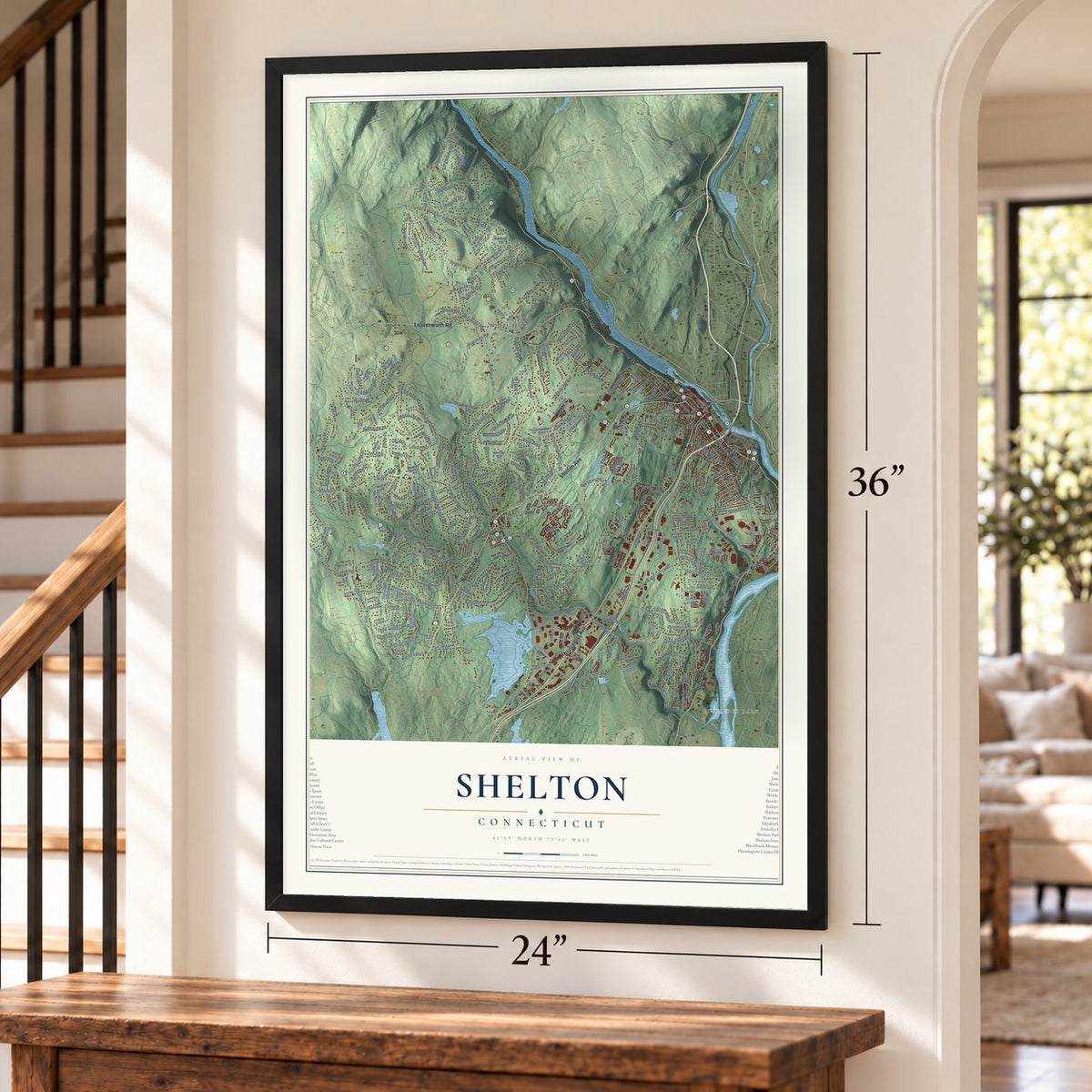 Shelton, Connecticut map, 24 x 36 inch print in a black frame by a staircase
