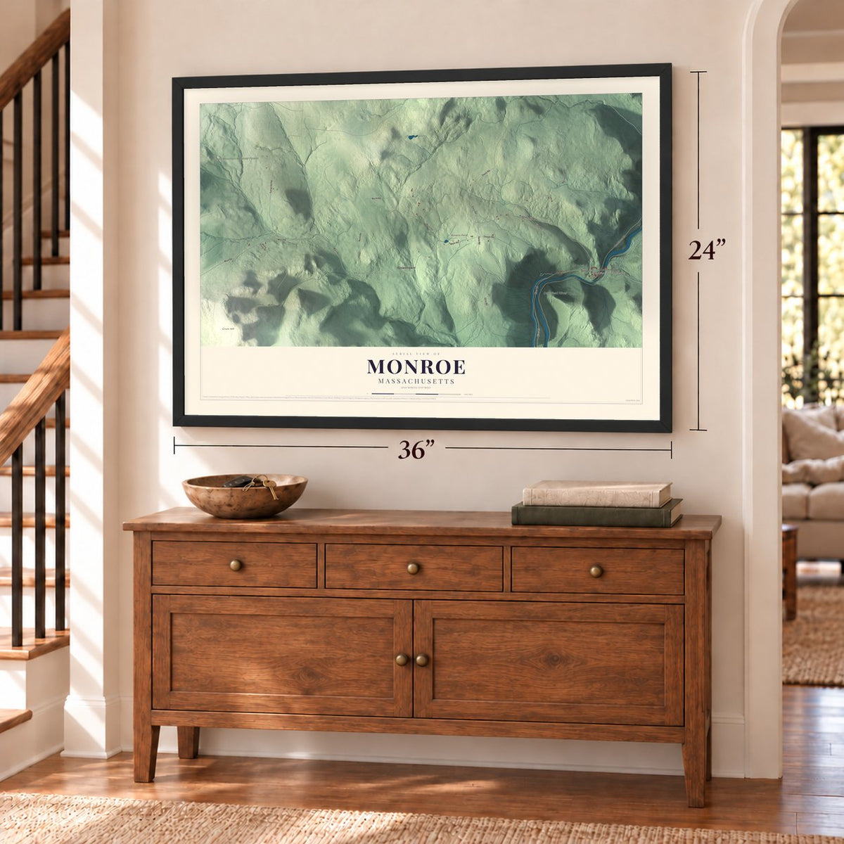 Monroe, Massachusetts map, 24 x 36 inch print in a black frame above a dresser by a staircase