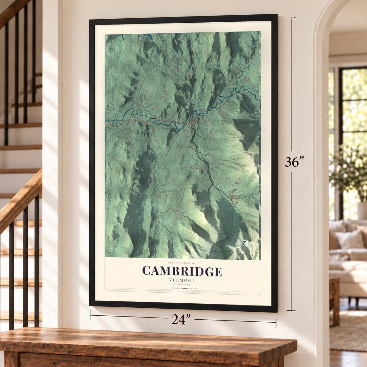 Cambridge, Vermont map, 24 x 36 inch print in a black frame by a staircase