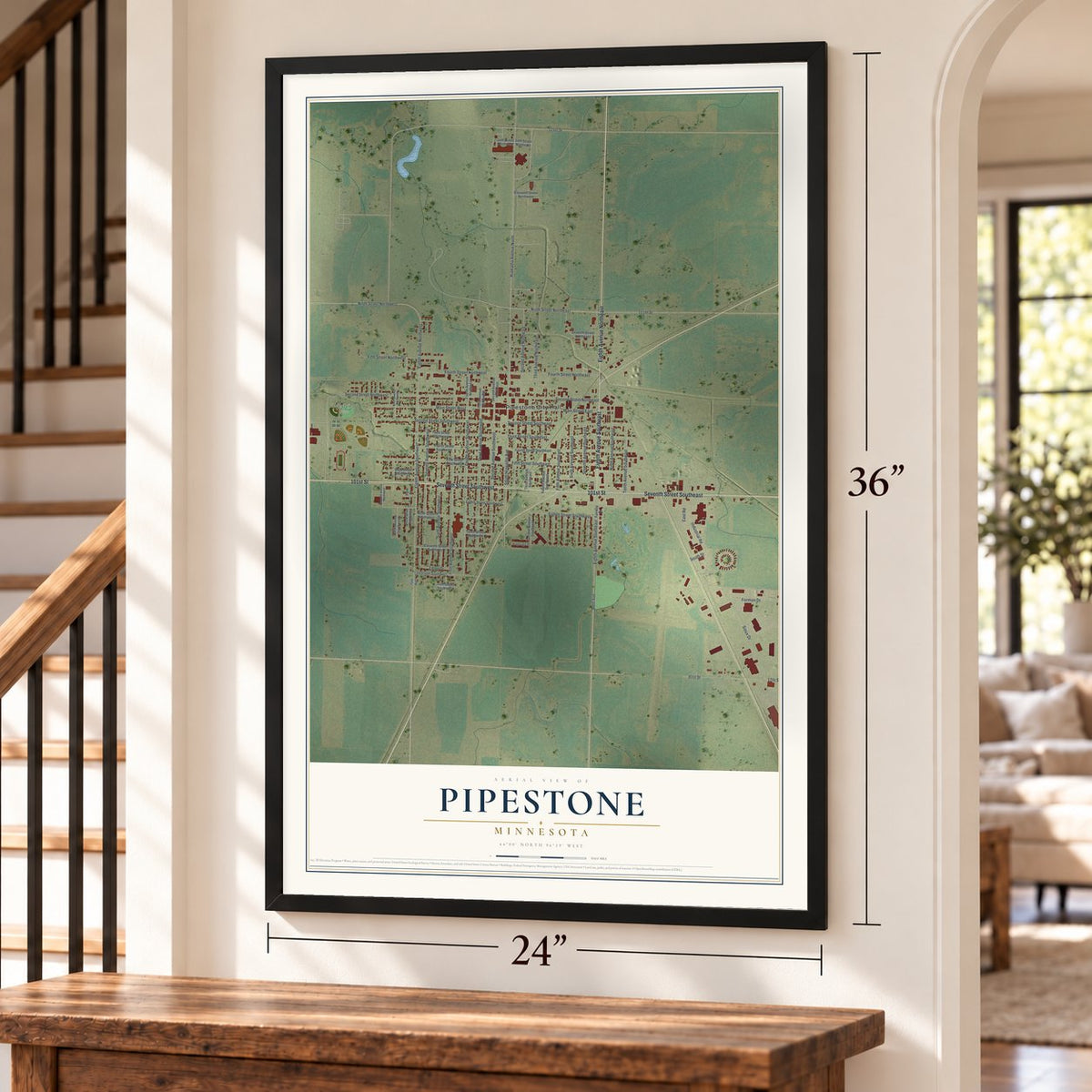 Pipestone, Minnesota map, 24 x 36 inch print in a black frame by a staircase