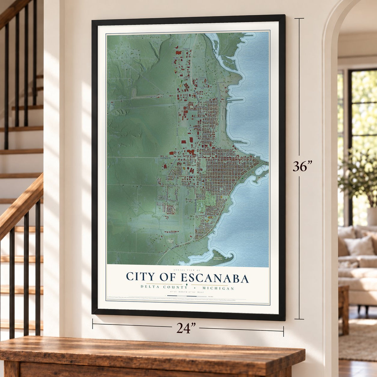 Escanaba, Michigan map, 24 x 36 inch print in a black frame by a staircase