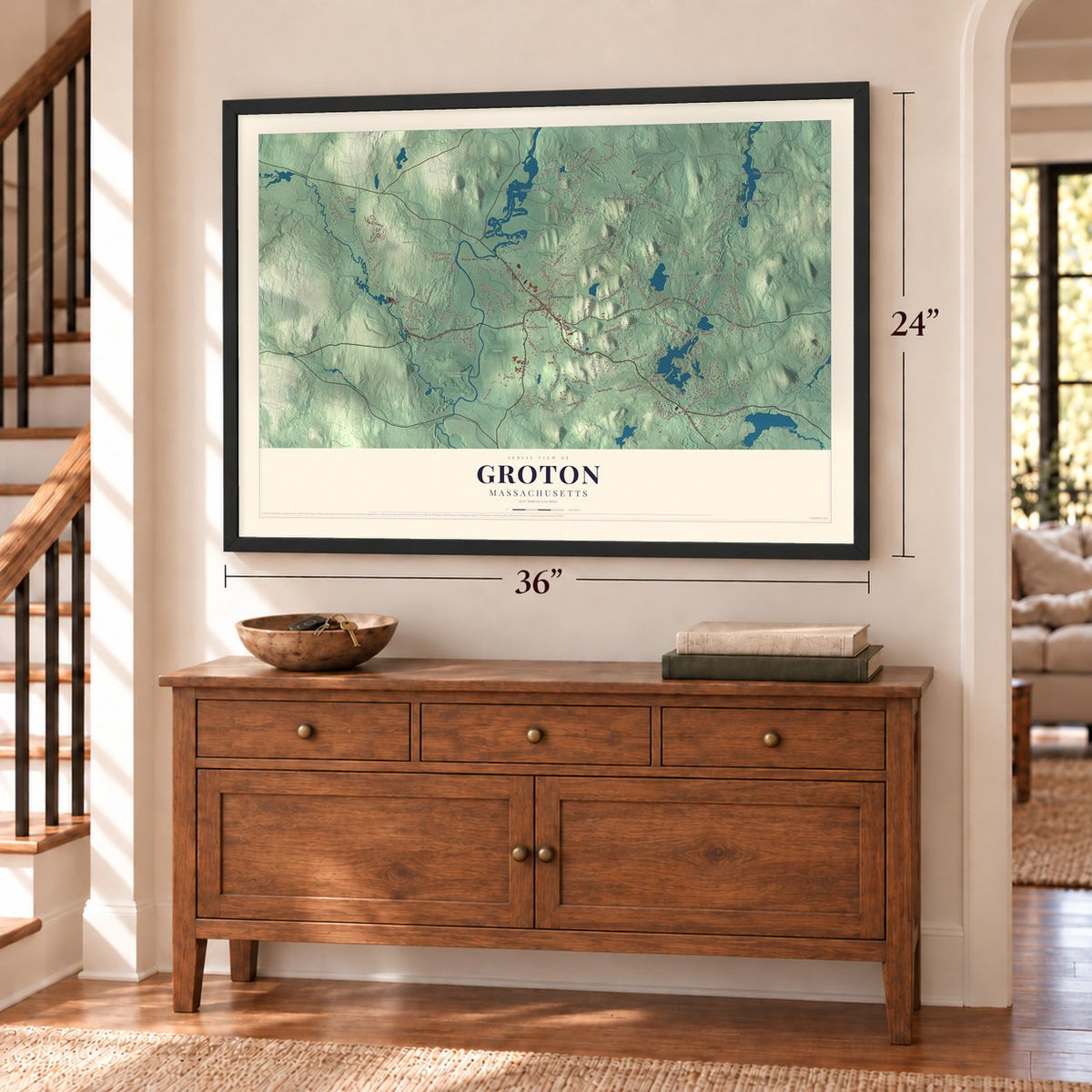Groton, Massachusetts map, 24 x 36 inch print in a black frame above a dresser by a staircase