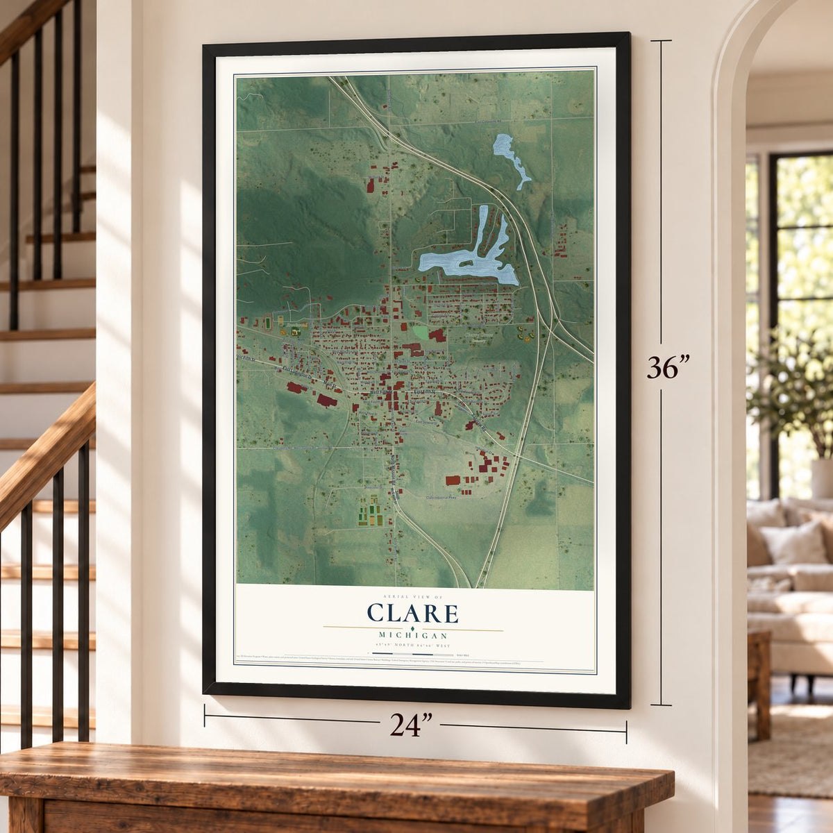 Clare, Michigan map, 24 x 36 inch print in a black frame by a staircase