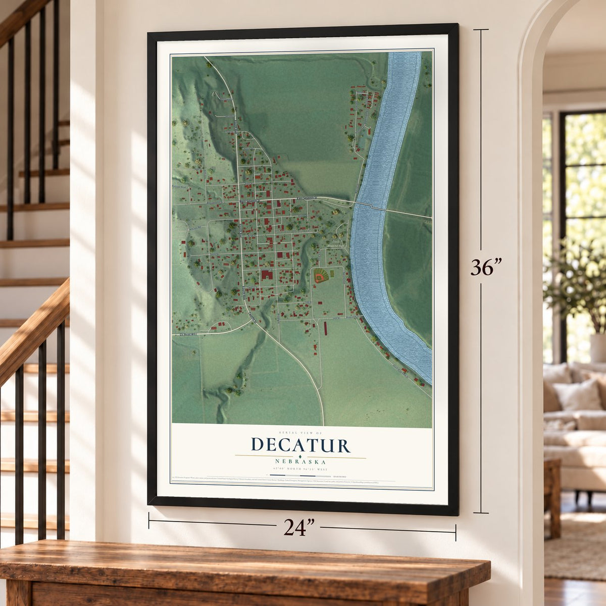 Decatur, Nebraska map, 24 x 36 inch print in a black frame by a staircase