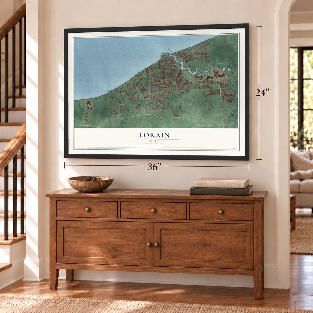 Lorain, Ohio map, 24 x 36 inch print in a black frame above a dresser by a staircase